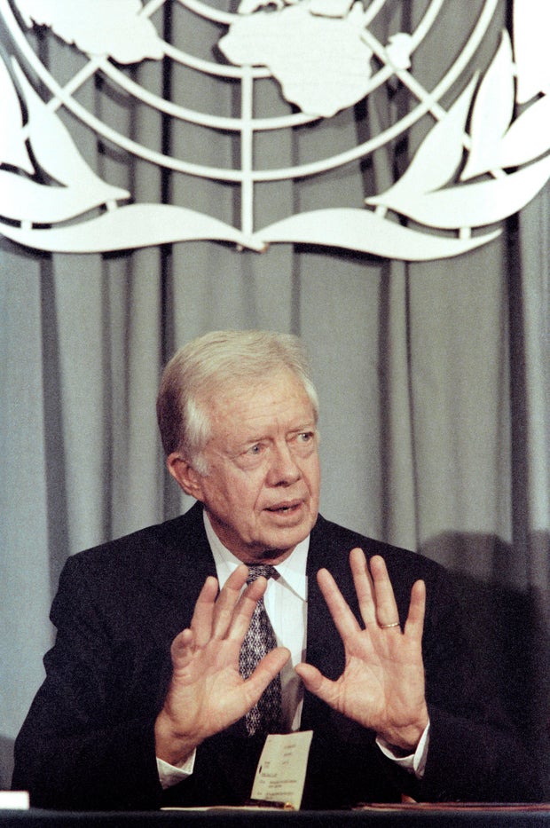 Former U.S. President Jimmy Carter speaks to reporters at the United Nations