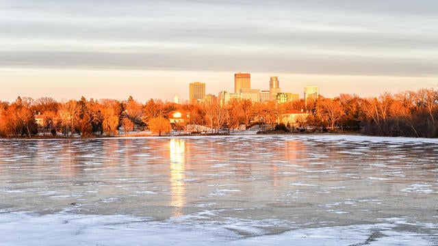 Frozen Lake of the Isles and Minneapolis Minnesota Skyline 