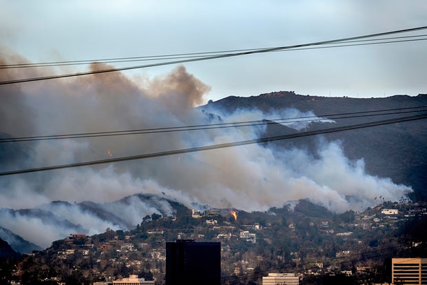 A fire burns on a hill in the Brentwood section of Los Angeles on January 8, 2025.