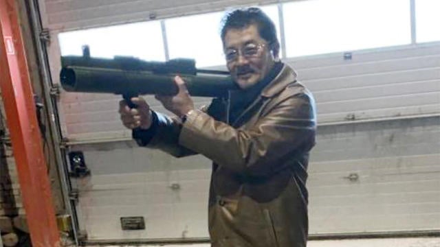 FILE PHOTO: Takeshi Ebisawa poses with a rocket launcher during a meeting with an informant at a warehouse in Copenhagen 