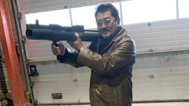 FILE PHOTO: Takeshi Ebisawa poses with a rocket launcher during a meeting with an informant at a warehouse in Copenhagen
