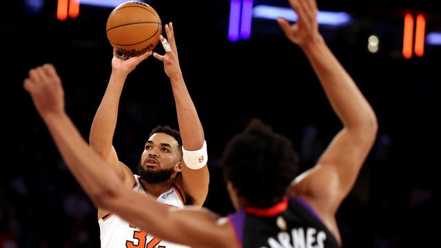 Karl-Anthony Towns #32 of the New York Knicks shoots against Scottie Barnes #4 of the Toronto Raptors during their game at Madison Square Garden on January 08, 2025 in New York City. 