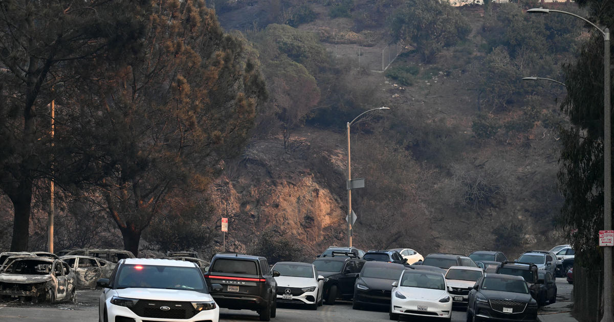 Throngs of abandoned cars line the streets of Pacific Palisades