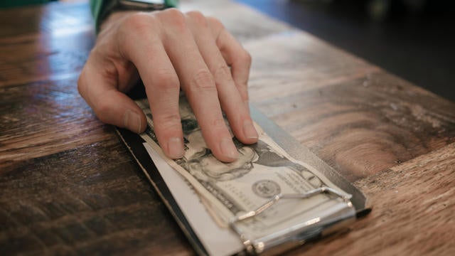 Man Pays in Cash at Restaurant 