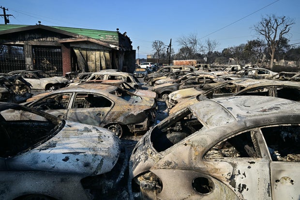 Cars belonging to the Altadena Auto Center dealership that were destroyed by the Eaton Fire are seen in a lot in Altadena, California, Jan. 10, 2025.