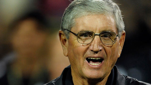 Former CU coach Bill McCartney held the 1990 National Championship trophy at halftime. The University of Colorado football team defeated the University of Georgia 29-27 Saturday night, October 2, 2010 at Folsom Field in Boulder. Karl Gehring/The Denver Po