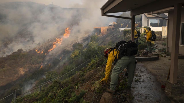 Firefighters at a home in Los Angeles 