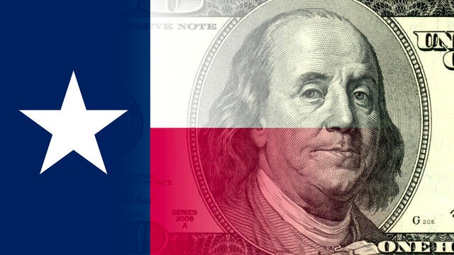 One hundred dollar bill on the background of the Texas flag 