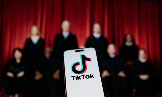 A photo illustration showing the TikTok logo in front of the justices of the Supreme Court.