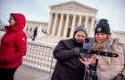 Content creators stand outside the Supreme Court during oral arguments on whether to overturn or delay a law that could lead to a ban of TikTok in the U.S., on Jan. 10, 2025, in Washington, D.C. 