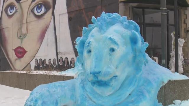 Local artist creates snow sculpture dedicated to Detroit Lions 