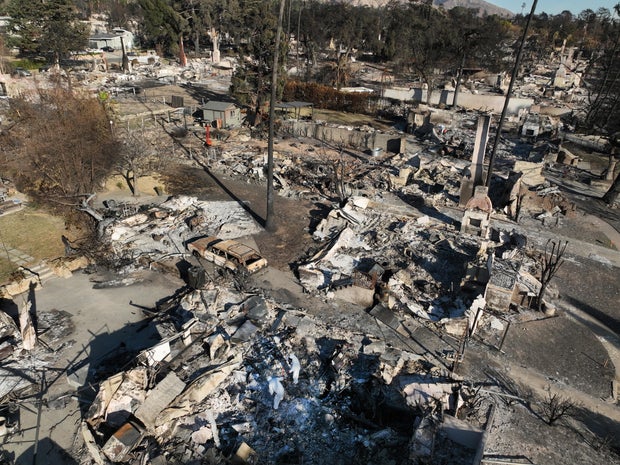 Eaton fire victims return to their burned out homes in Altadena 