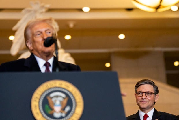 Speaker of the House Mike Johnson looks on as President Trump delivers remarks in Emancipation Hall during inauguration ceremonies at the Capitol in Washington, DC, on January 20, 2025.