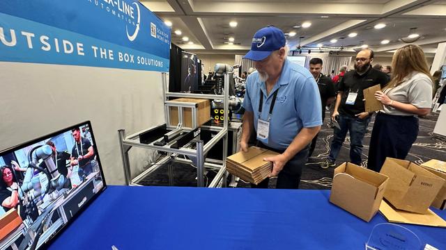 Boxes on a display table at the convention center. 