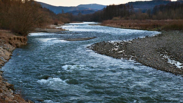 A Raba river flows through the village of Pcim, Poland. 