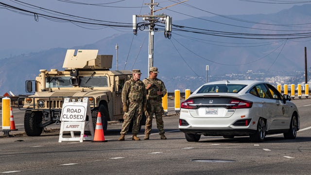 National Guard diverting pedestrians and cyclists from entering Pacific Palisades and Pacific Coast Highway during the Palisade Fire, January 19, 2025 