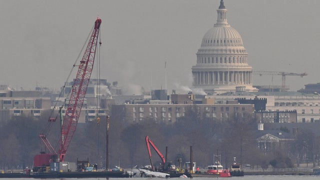 A crane is in position in the Potomac River near where an American Airlines plane collided with a U.S. Army helicopter near Ronald Reagan Washington National Airport in Arlington, Virginia, on Feb. 3, 2025. 