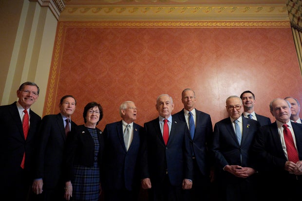 Israeli Prime Minister Benjamin Netanyahu poses for photographs before sitting down to lunch with Senate Majority Leader John Thune and other senators at the U.S. Capitol on February 06, 2025 in Washington, DC.
