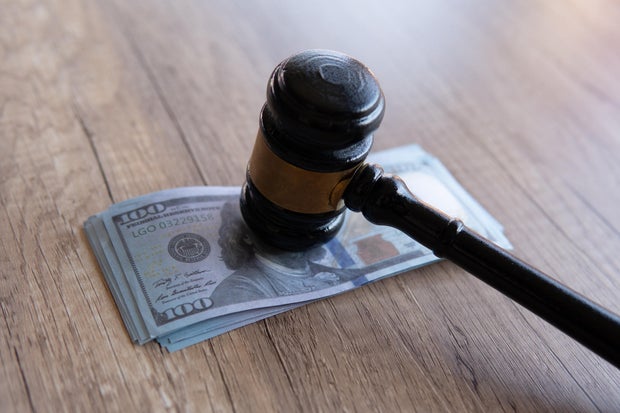 Closeup image of gavel and money. 