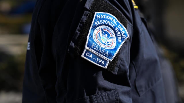 Los Angeles Fire: Search and Rescue team look for human remains in debris of burned houses 