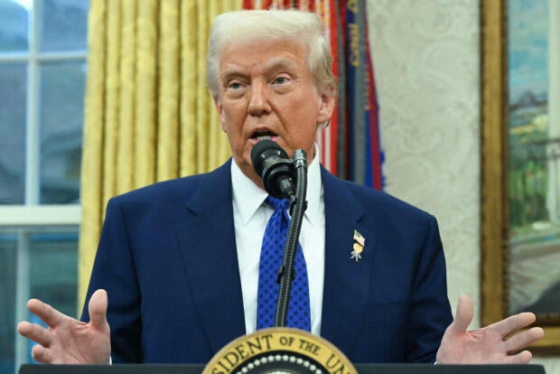 President Trump speaks after Tulsi Gabbard was sworn in as director of national intelligence in the Oval Office at the White House in Washington, D.C., on Feb. 11, 2025.