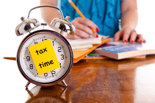 Time: Alarm clock, income tax time description. Woman background. remind. 