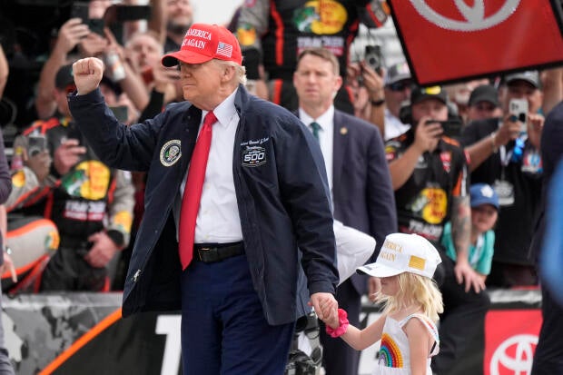 President Donald Trump, with his granddaughter Carolina, attends the NASCAR Daytona 500 at Daytona International Speedway in Daytona Beach, Florida, on Feb. 16, 2025. 