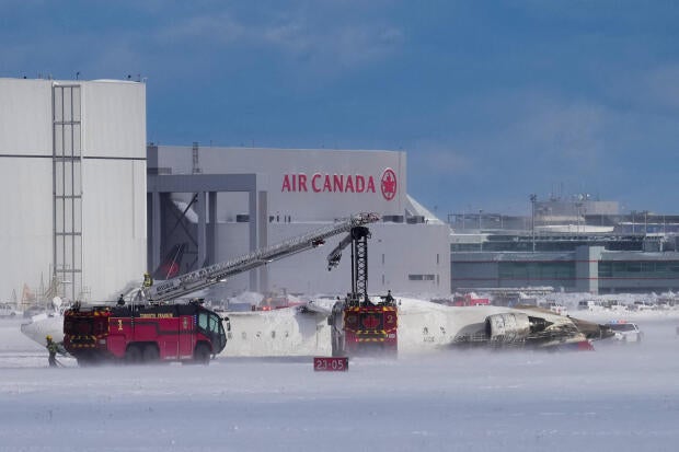 First responders work the scene at the Delta Air Lines plane crash site at Toronto Pearson International Airport in Mississauga, Ontario, Canada, Feb. 17, 2025.