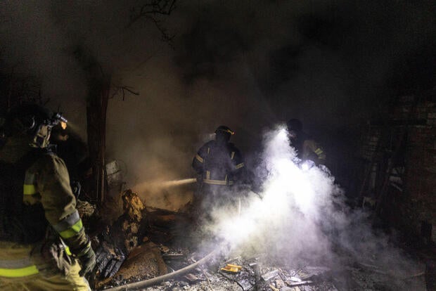 Ukrainian firefighters respond to a fire after Russian shelling in Kostiantynivka