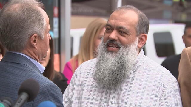 Celal Emanet speaks to a man during Thursday's event at Jersey Kebab 