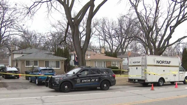 Police car with blue lights on the crime scene in traffic urban environment. 