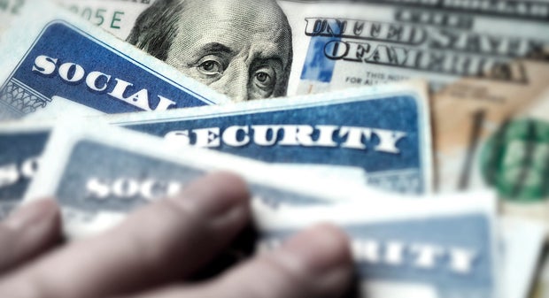 Social Security Cards with US One Hundred Dollar Bill $100 