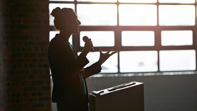 Businesswoman doing a lecture in auditorium 