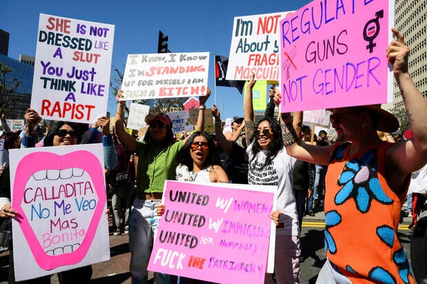 Demonstrators cheer during a march to commemorate International Women's Day Saturday, March 8, 2025, in Los Angeles