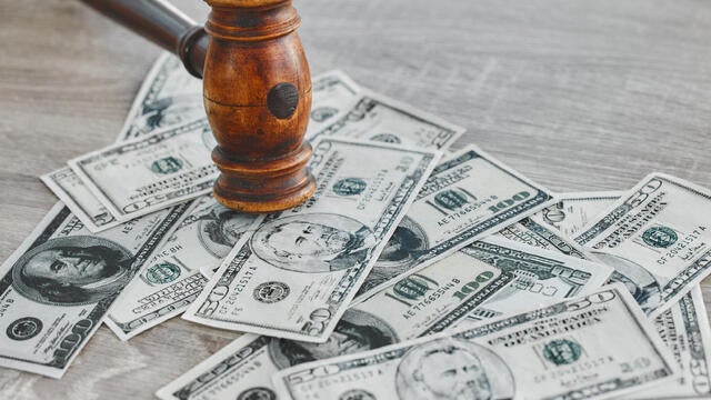 Gavel, money and legal, bribery or fraud with payment deal, criminal or justice in corruption. Background of cash and courtroom hammer for financial crime, auction or debt with ethics or constitution 