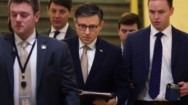 Speaker of the House Mike Johnson talks with reporters inside the U.S. Capitol building ahead of votes in Washington, DC on March 6, 2025. 