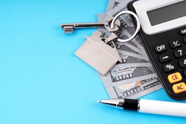 Paper Currency, House Key and Calculator