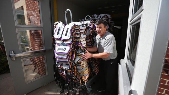 Minnesota Vikings equipment manger Dennis Ryan pushed a stack of shoulder pads to a truck as the team prepared to leave Minnesota State University after 52 years in Mankato Monday August 7, 2017 in Mankato, MN. ] JERRY HOLT ‚Ä¢ jerry.holt@startribune.c 