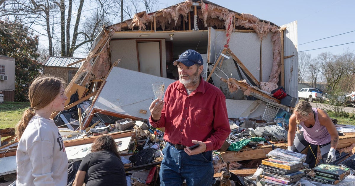 At least 40 killed in storm system that spawned tornadoes and fanned wildfires across U.S.