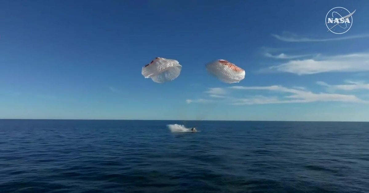 NASA astronauts return to Earth, splashing down off Florida coast - CBS ...