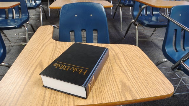 Holy Bible Lying on a Parochial School Desk 
