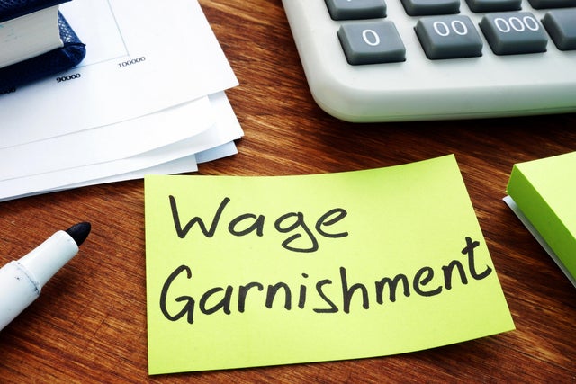 Wage Garnishment written on the yellow sheet. 