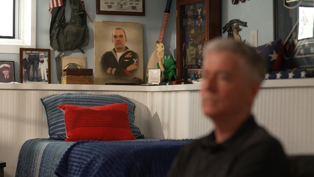 A picture of Ryan Larkin behind Frank Larkin