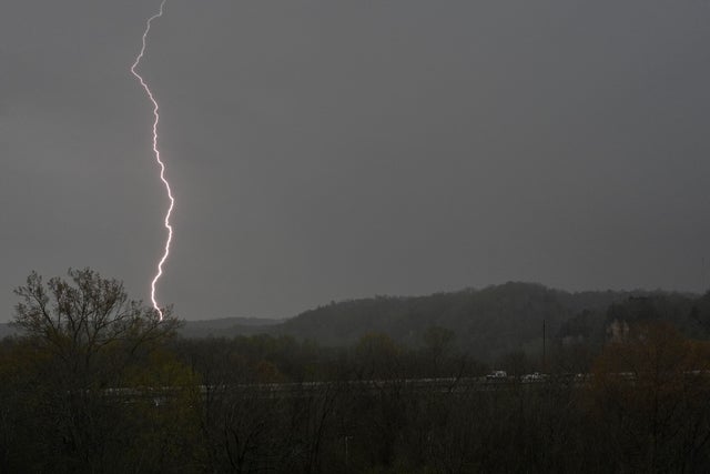 Lightning strikes as storms move through the area around Ashland City, Tennessee, April 2, 2025. 