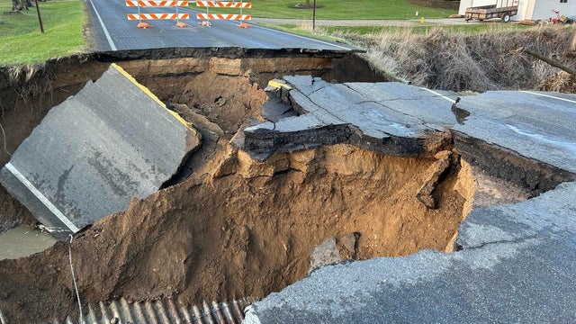 Road in Clinton County, Michigan collapses into small stream 