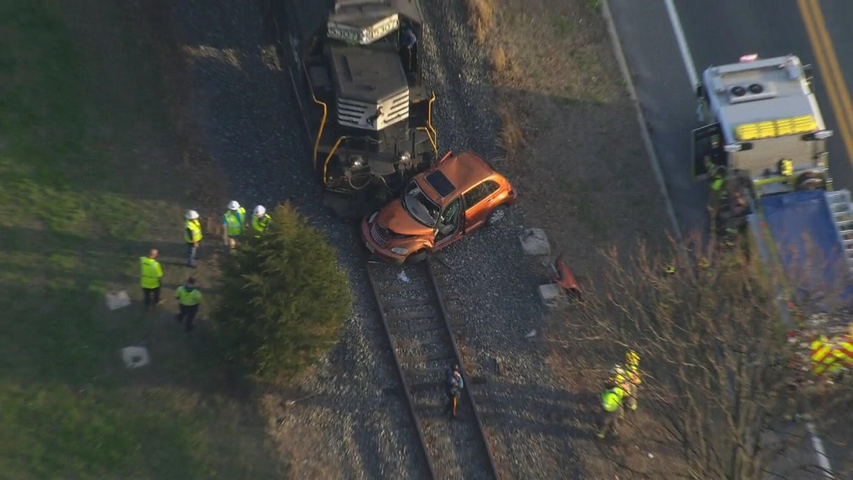 Chopper photo shows A car that is damaged after it was hit by a train, emergency crews are on the scene 