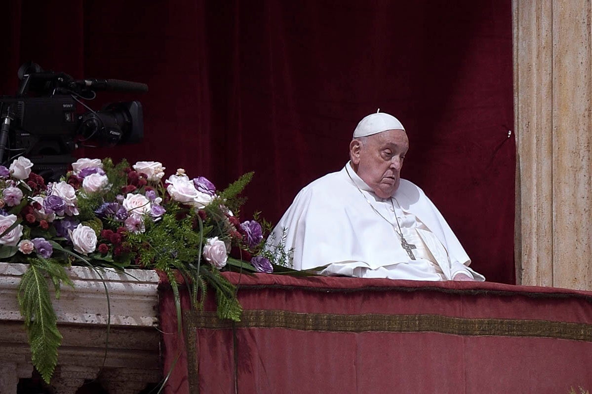 Pope Francis offers a blessing from the balcony of St. Peter's Basilica at the Vatican on Easter Sunday