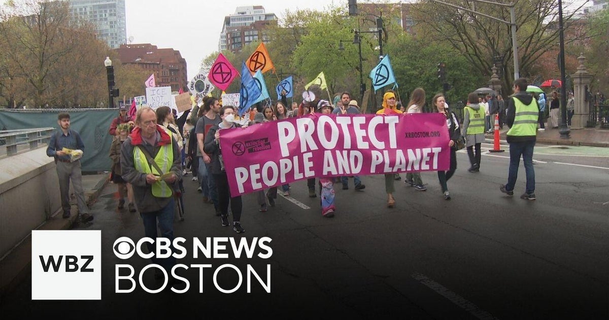 Climate activists march in Boston to highlight to environmental ...