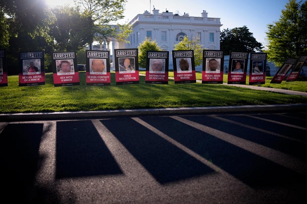 Posters depicting detained immigrants outside the White House