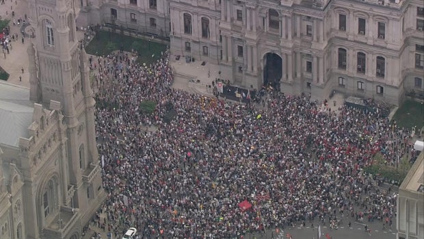 Crowd spills into the street outside City Hall in Center City Philadelphia 